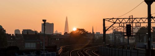 Scene looking towards the Shard with railway lines and sunset