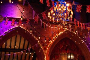 Theatre interior with glittering coloured lights and ornate decor