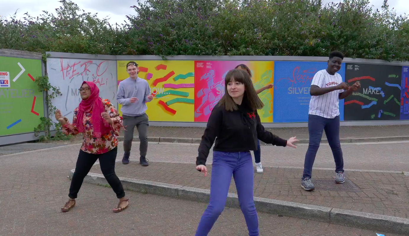 Five young people dancing