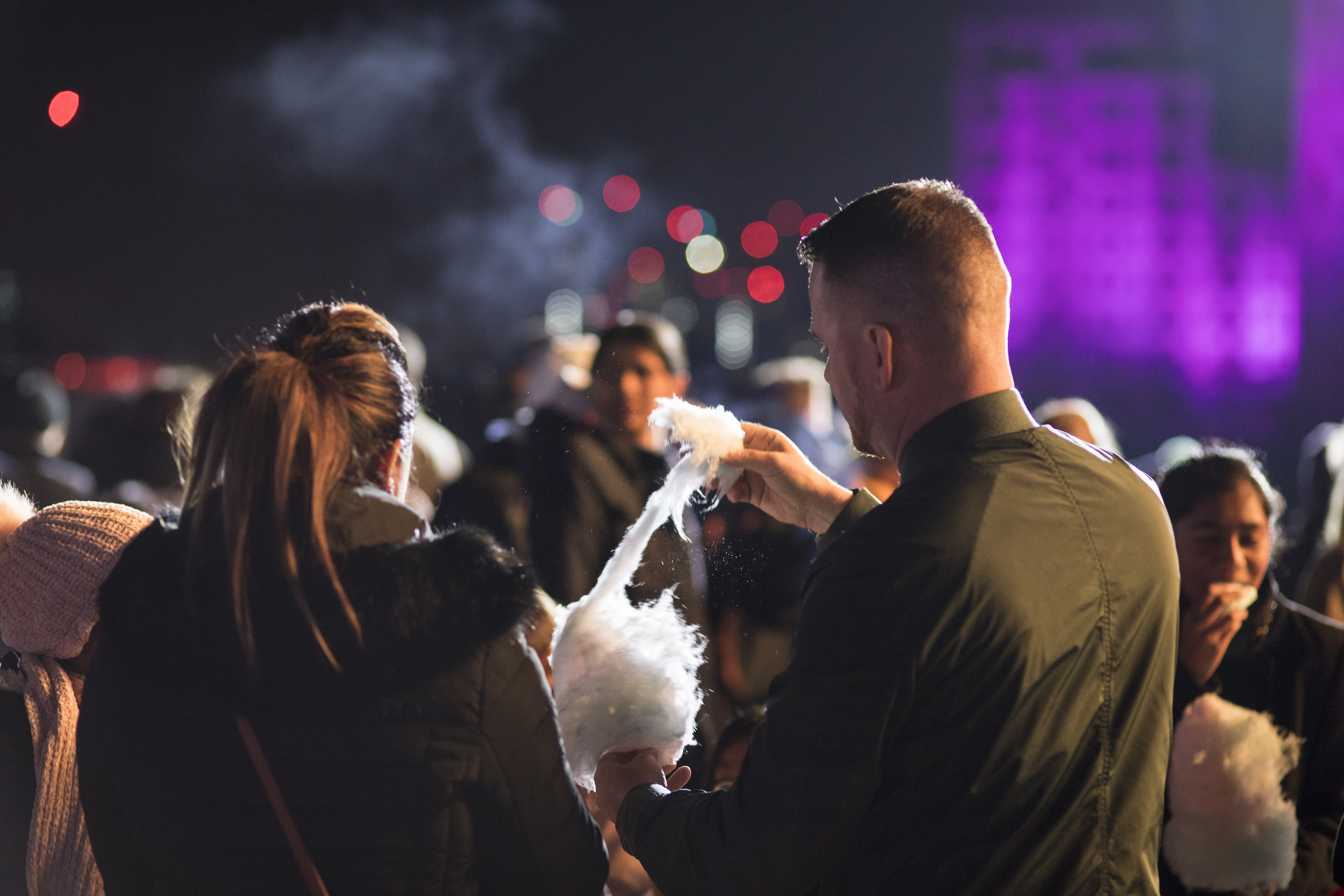 Two people enjoying candy floss