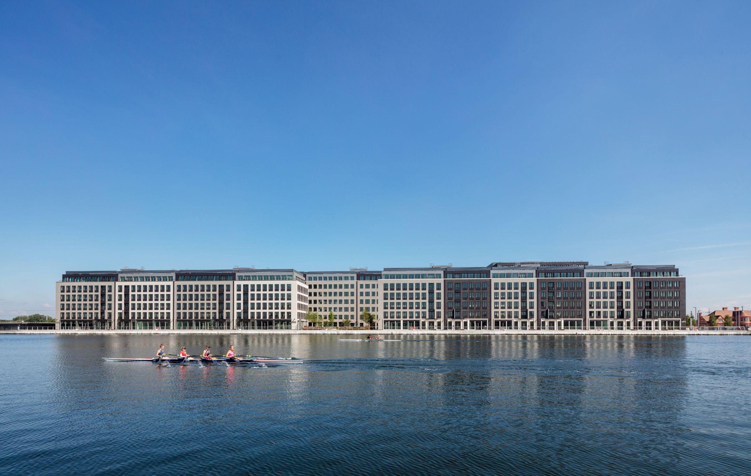 Developments along the Royal Dock with canoeists paddling past