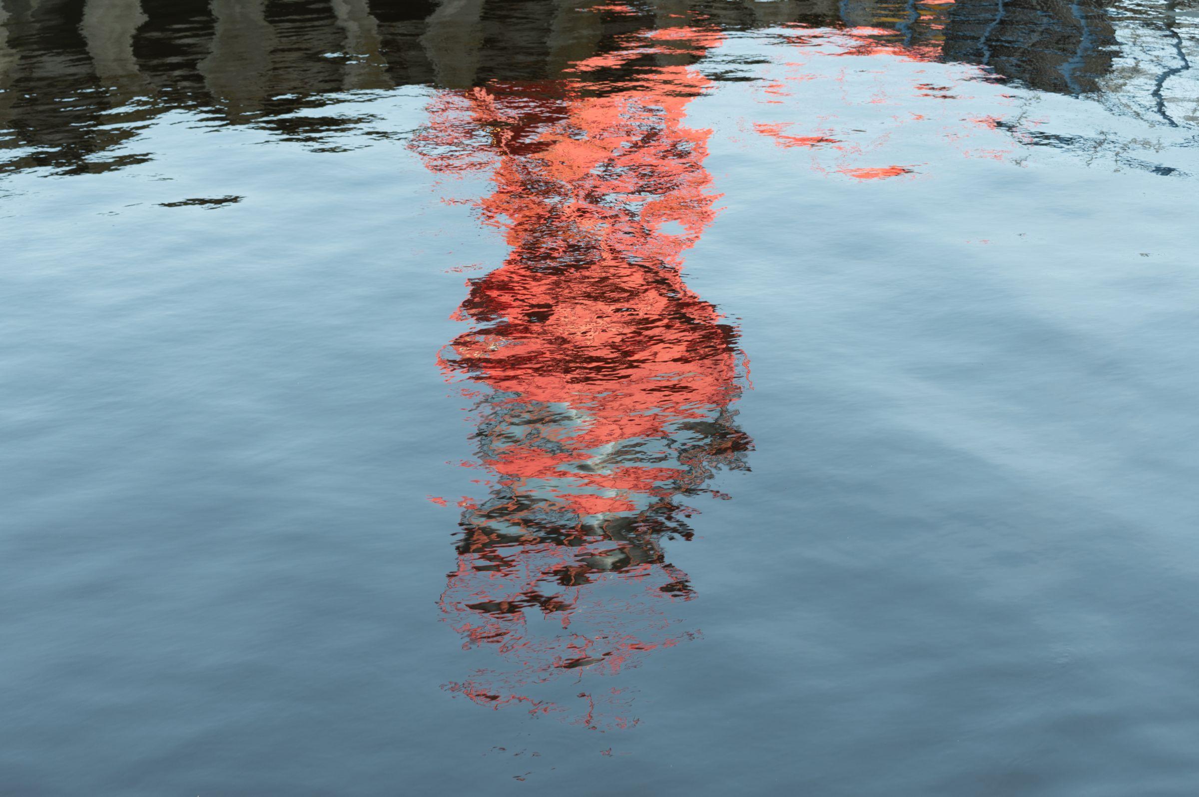 Reflection of a boat in the water