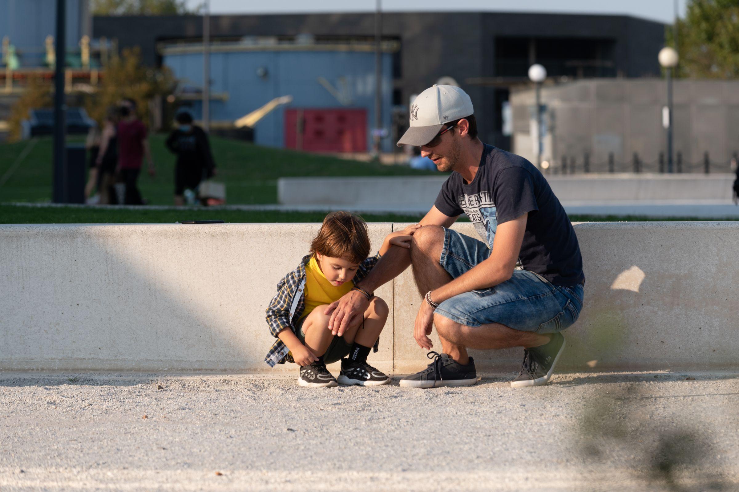 Father and son playing outside