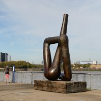 Giant bronze statue that looks a bit like legs, by the edge of the Thames