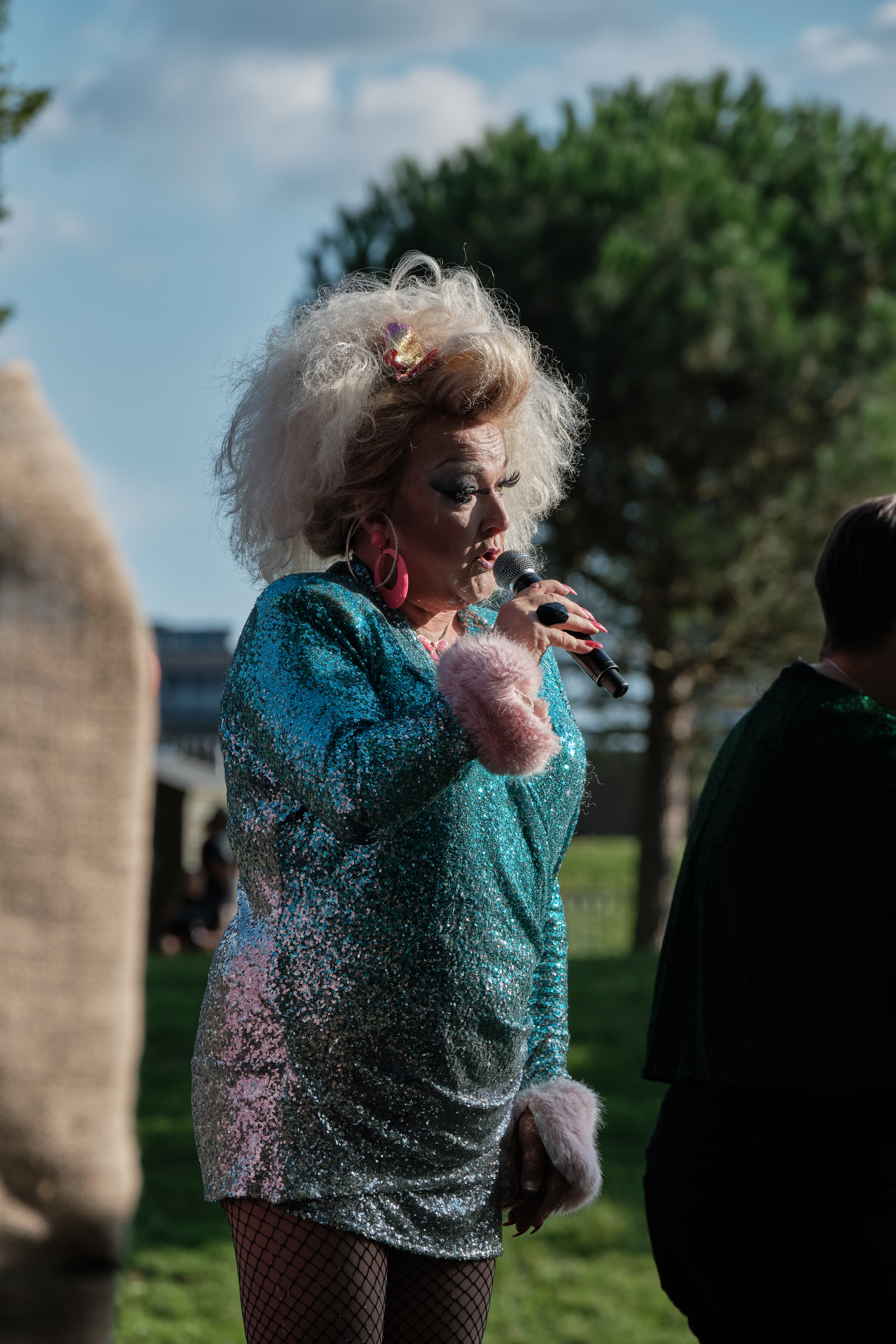 Drag queen in sequin dress on stage