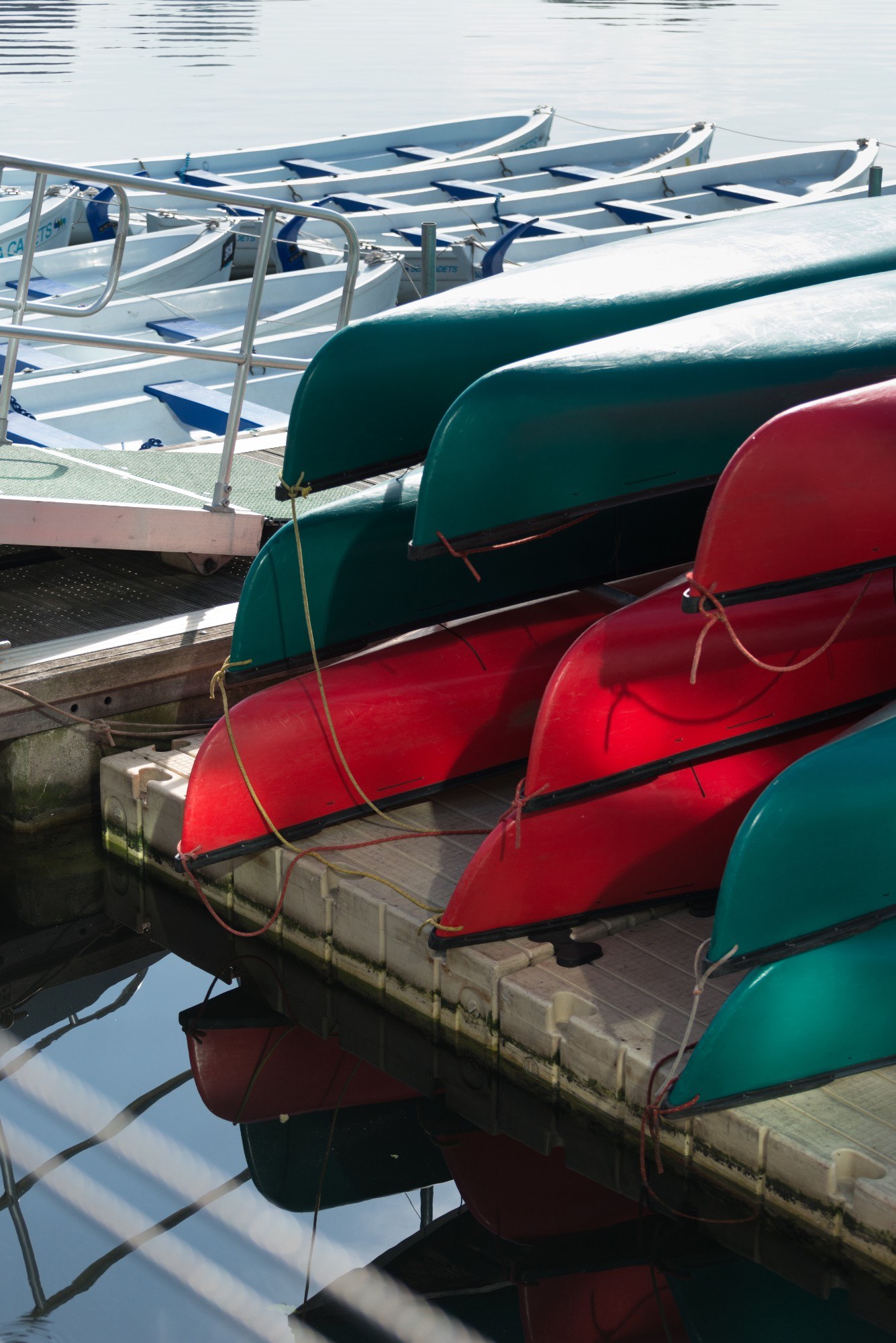 Boats on the waterside, bottom-side upward