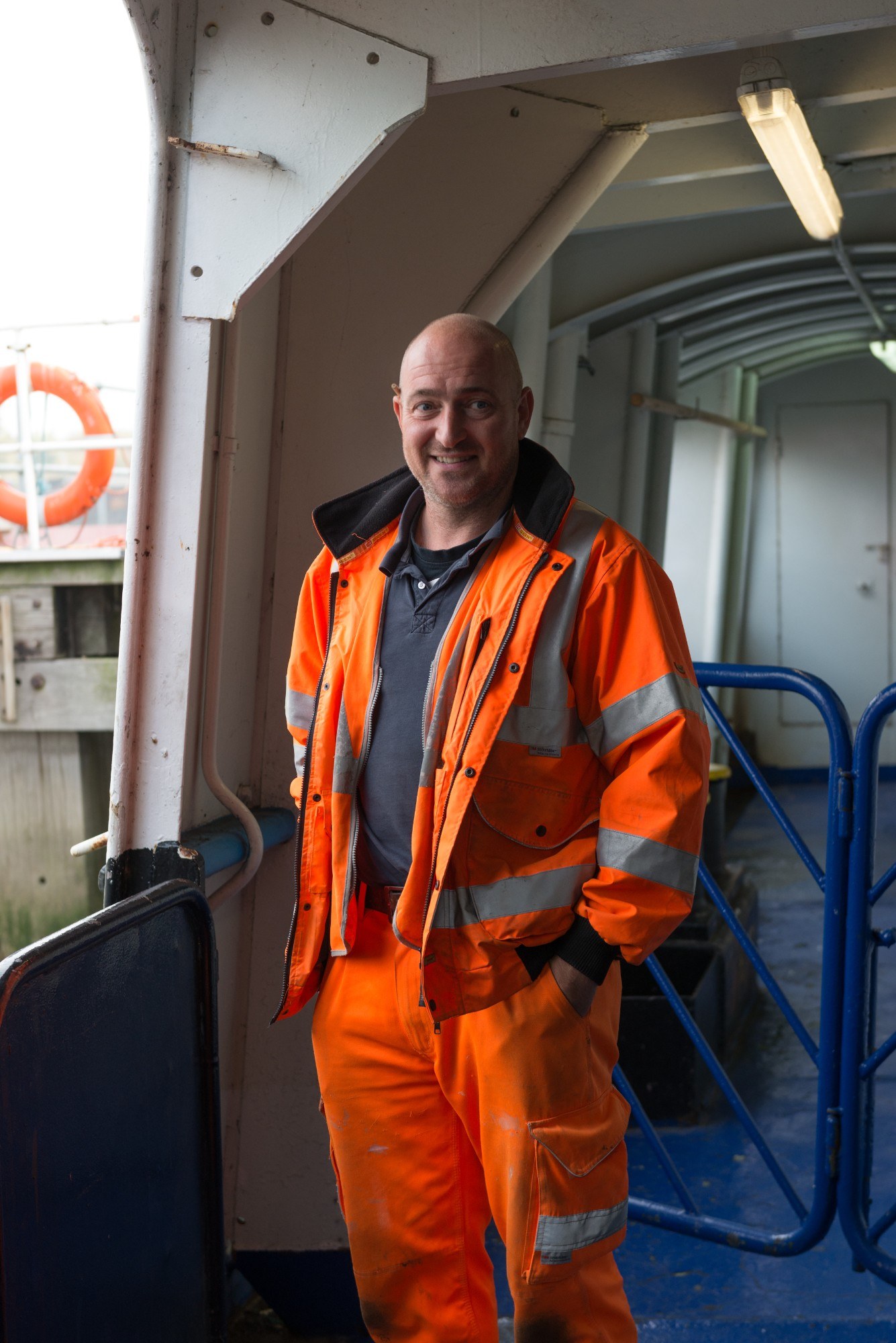 Portrait of man wearing high vis, on the ferry