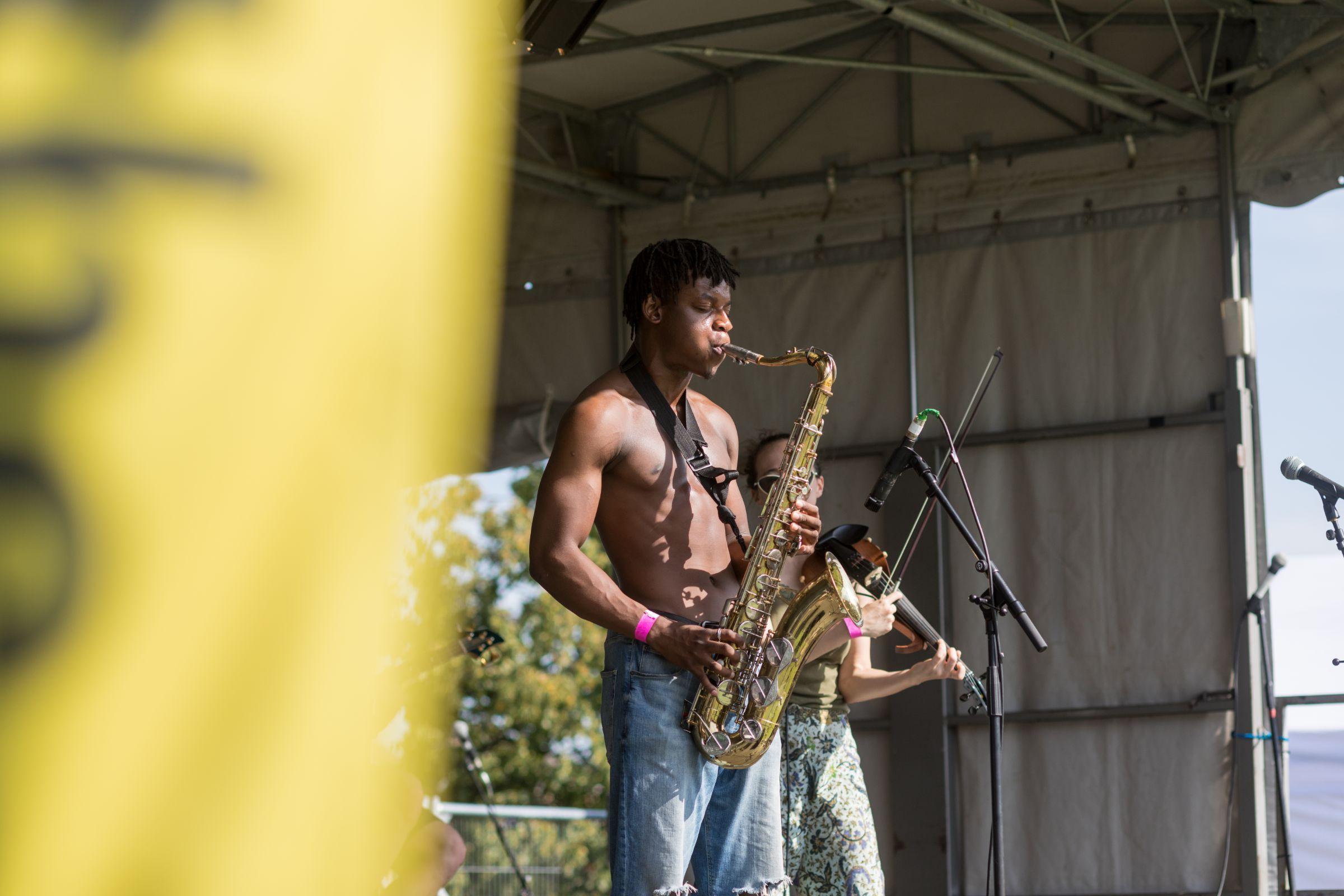 Man playing the saxophone on stage