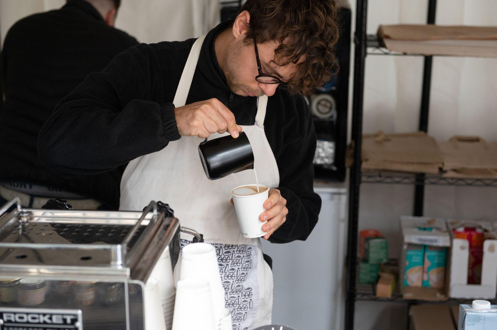 Loafly employee makes coffee