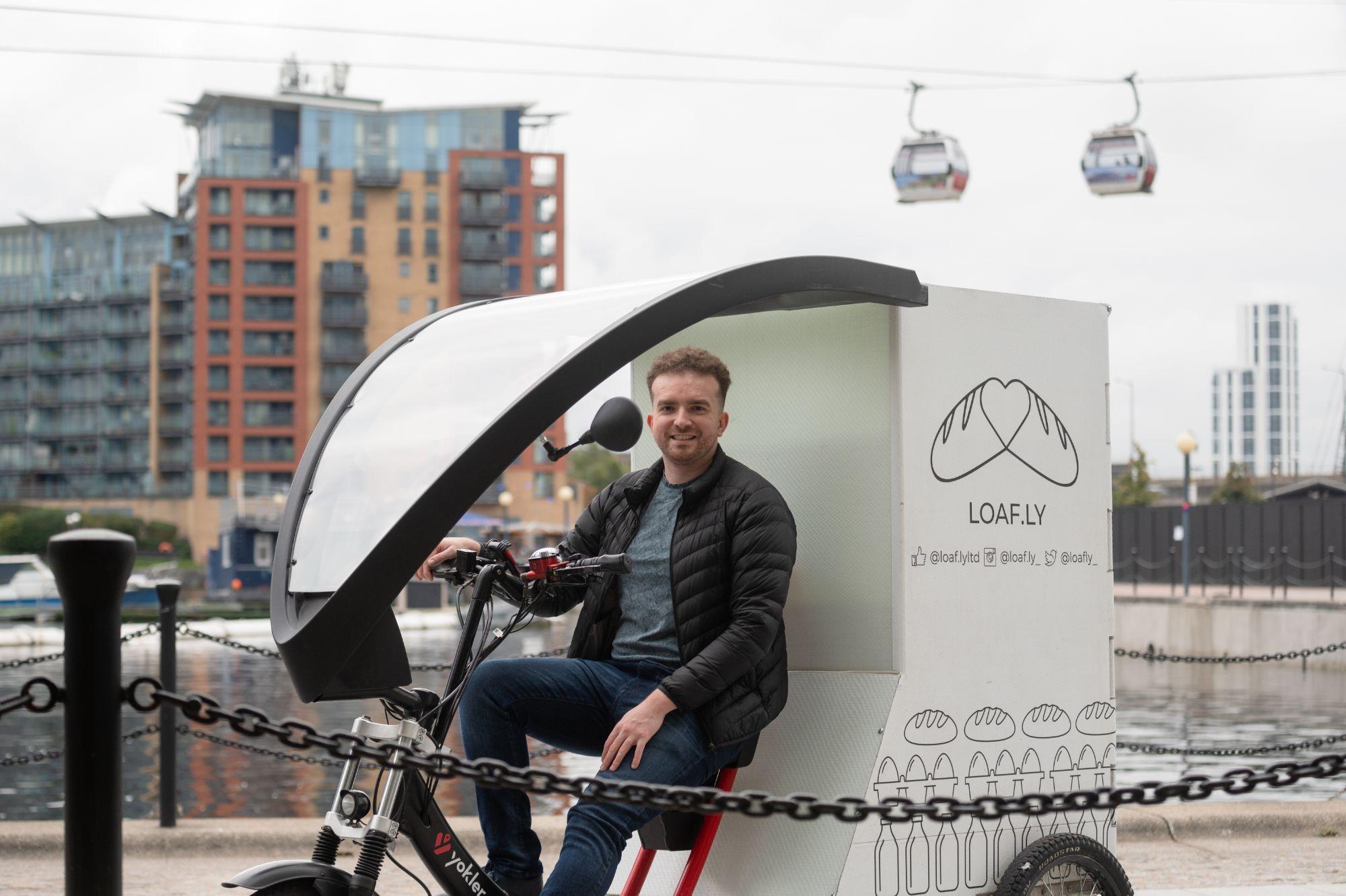 Ben sitting on the loafly delivery bike