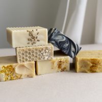 A stack of handmade soaps in different colours