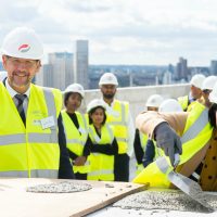 Newham Mayor celebrates topping out ceremony at Brunel Street Works