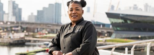 Photograph of Ona Brown in front of the Royal Docks