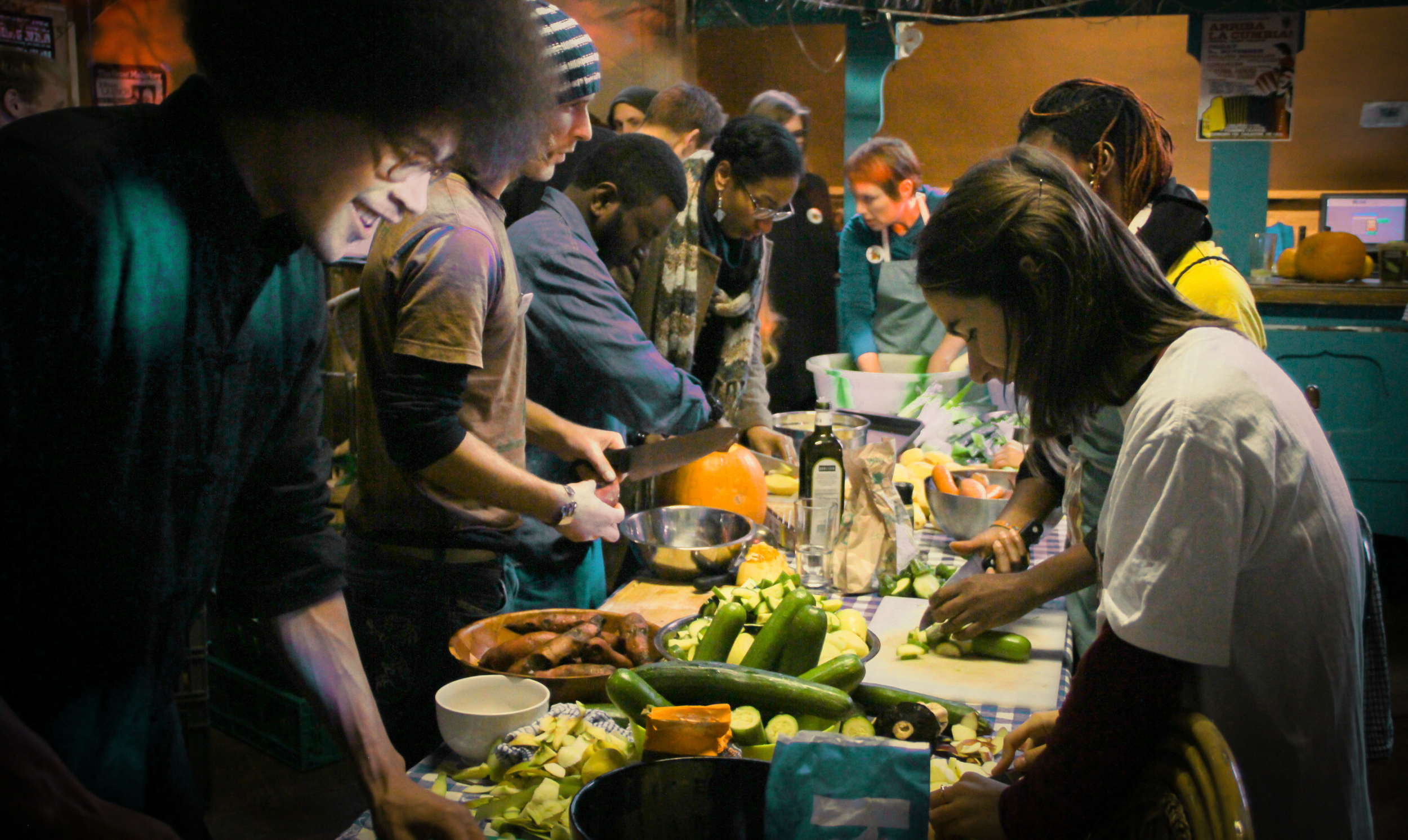 Food being prepared by a large group of people