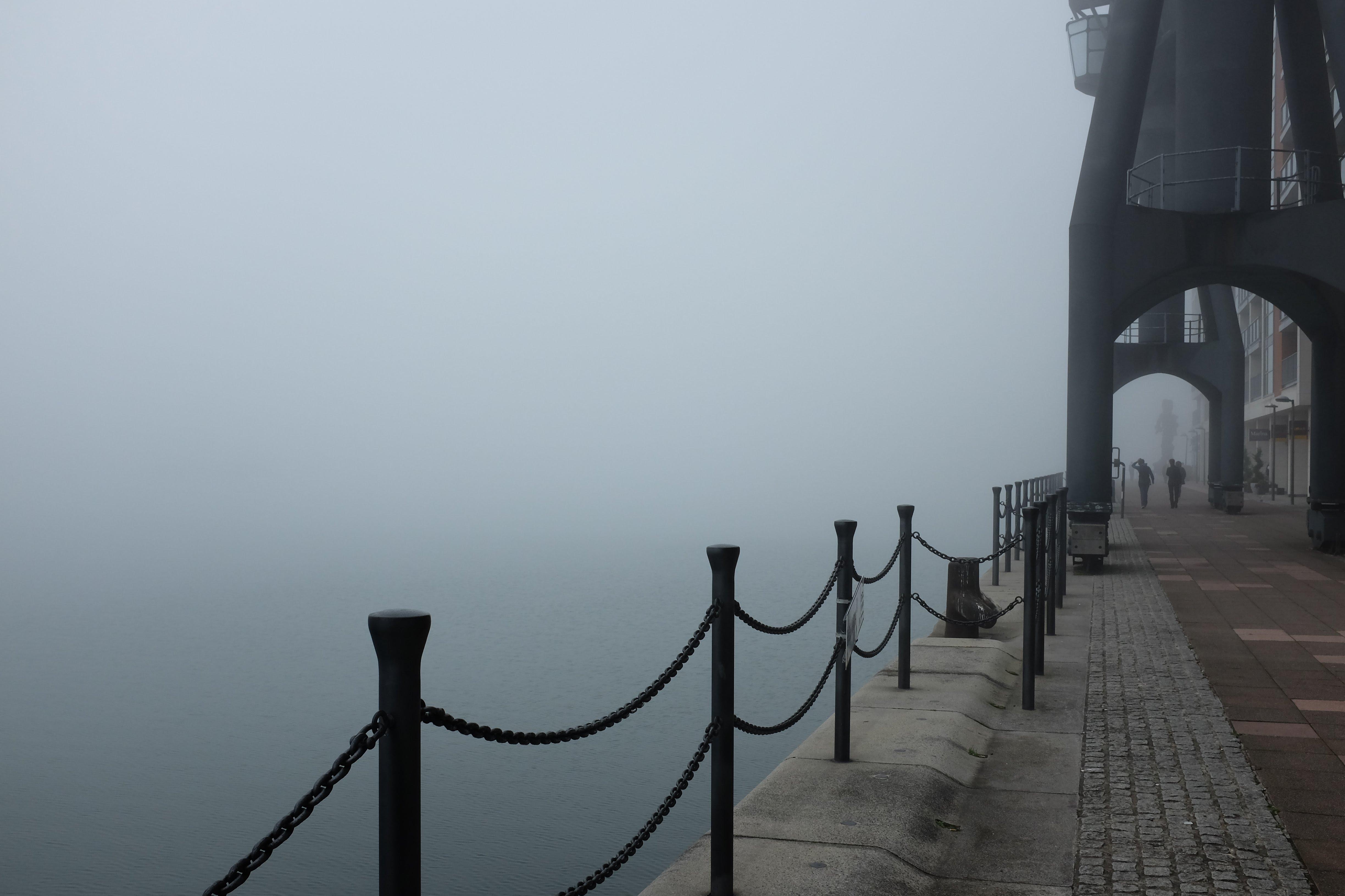 A photo on the banks of the Royal Docks with fog