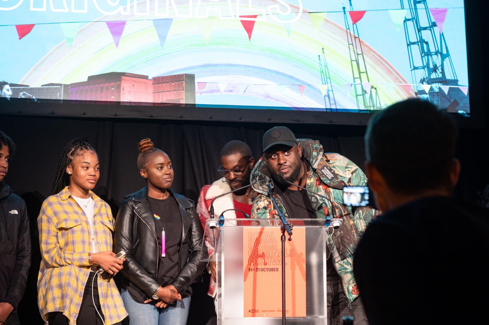 Kids from Grime Pays initiative on stage