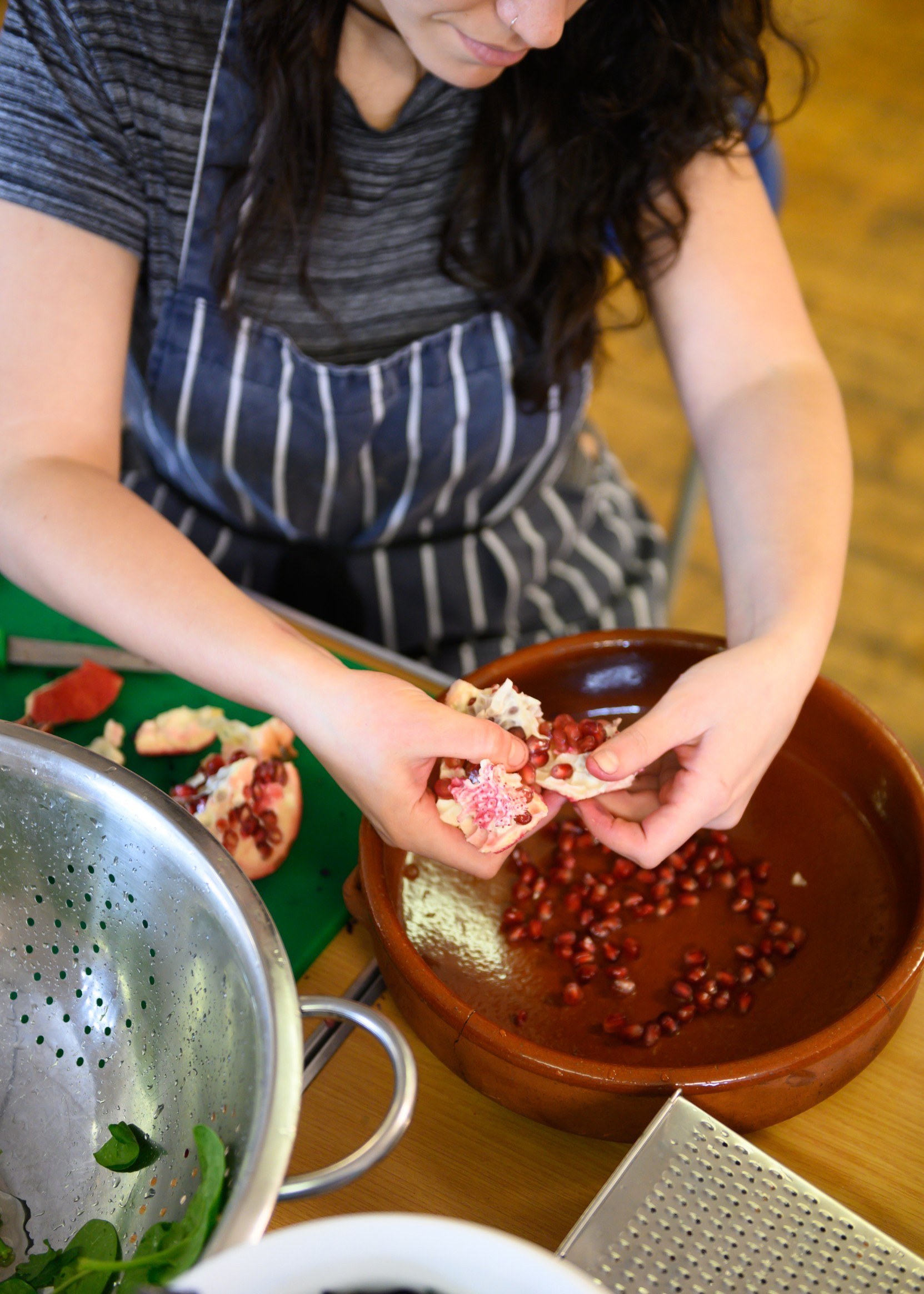 A woman preparing food in a bowl