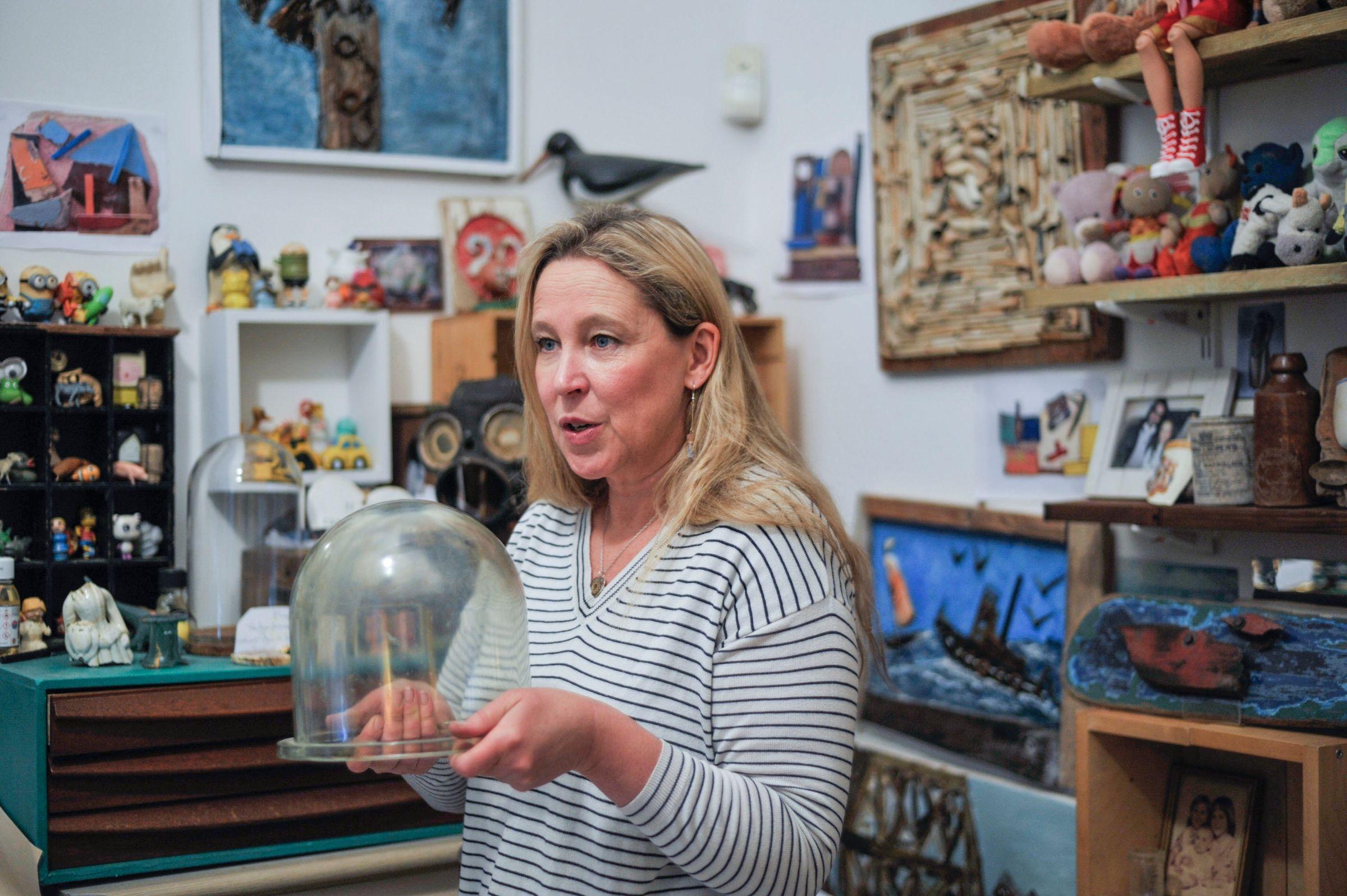 Nicola White holding item salvaged from the Thames