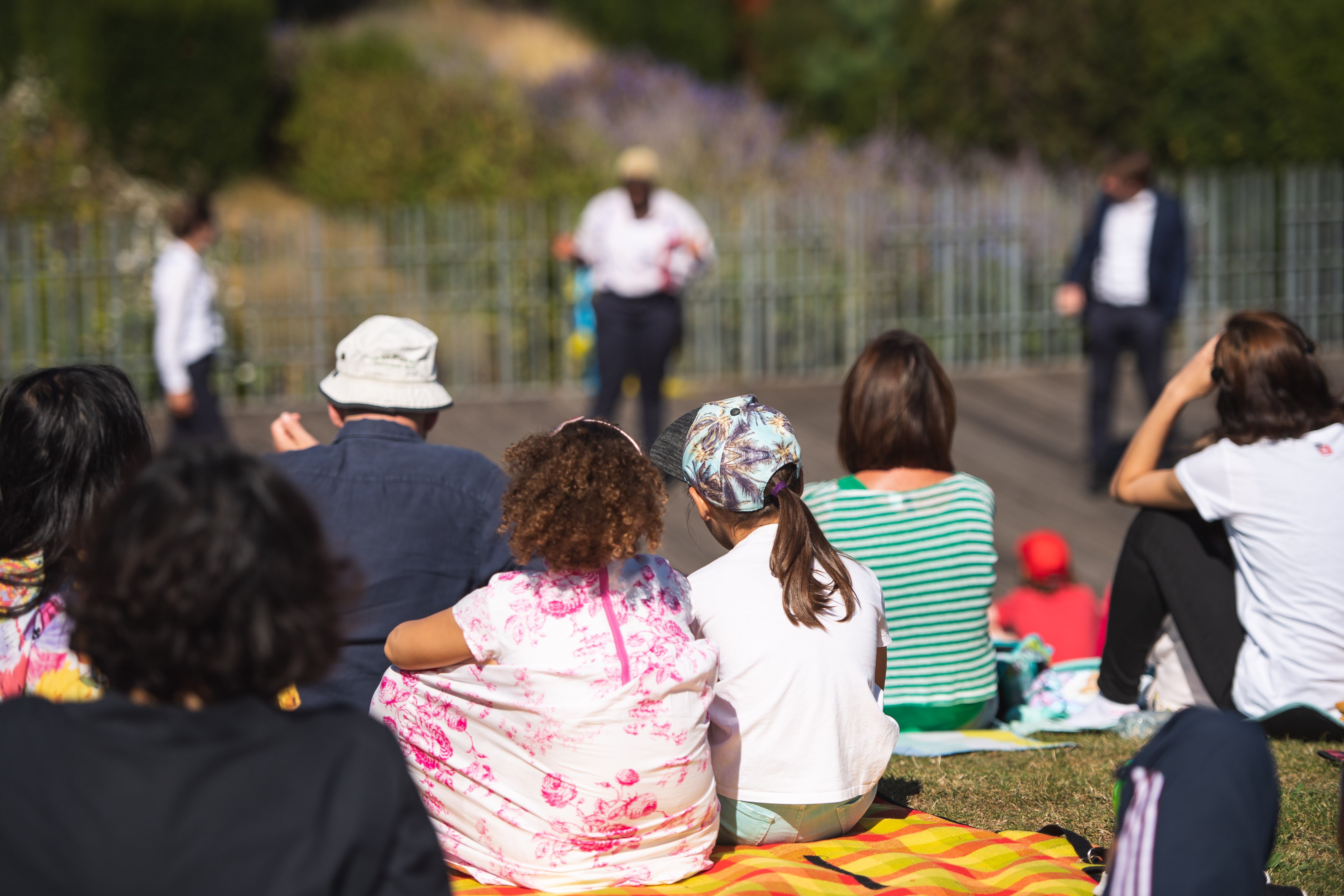 Audience watching outdoor play