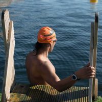 Swimmer getting to the dock water