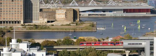Scene with DLR train, dock water, and ExCeL centre